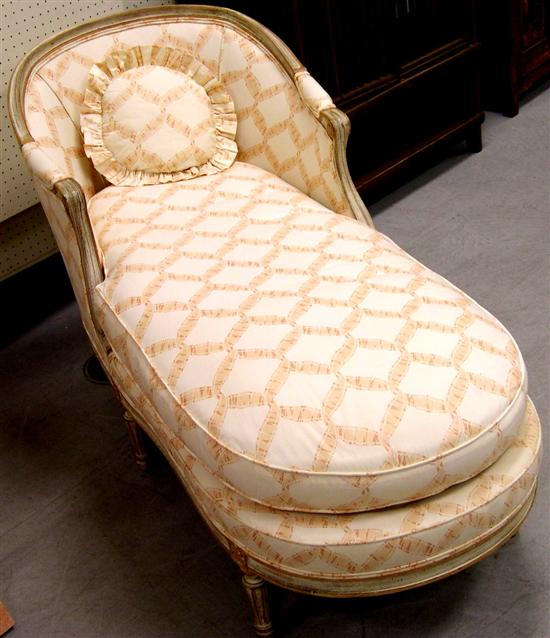 Appraisal: French style chaise lounge antiqued white frame peach and cream