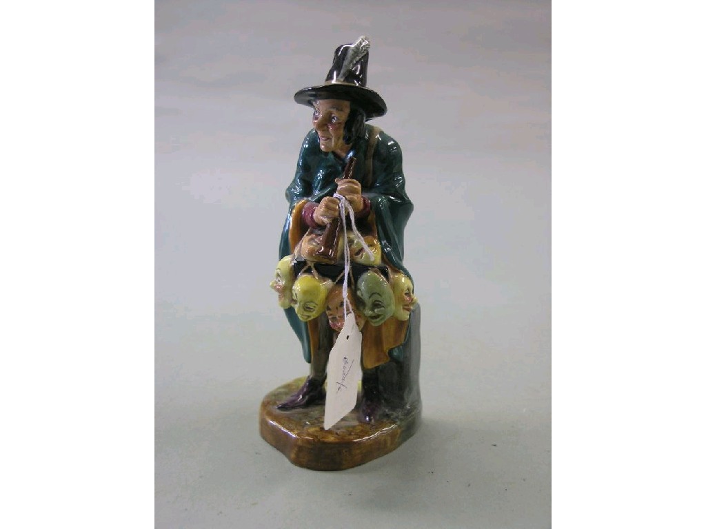 Appraisal: A Royal Doulton figure Mask Seller HN