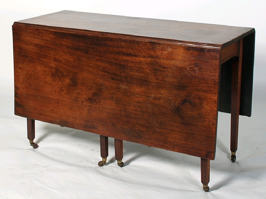 Appraisal: GEORGE III MAHOGANY DROP LEAF DINING TABLE the oblong top