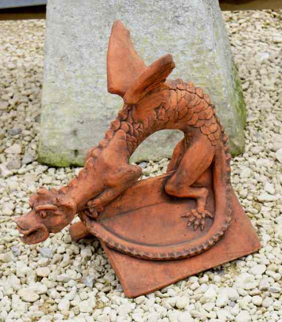 Appraisal: A TERRACOTTA ROOF TILE in the form of a dragon