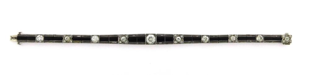 Appraisal: JEWELRY Platinum Art Deco diamond and onyx bracelet hinged bracelet