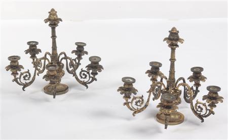 Appraisal: A pair of Regency gilt brass five light candelabra the