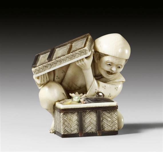 Appraisal: AN IVORY NETSUKE WITH INLAYS OF A KNEELING MAN WITH