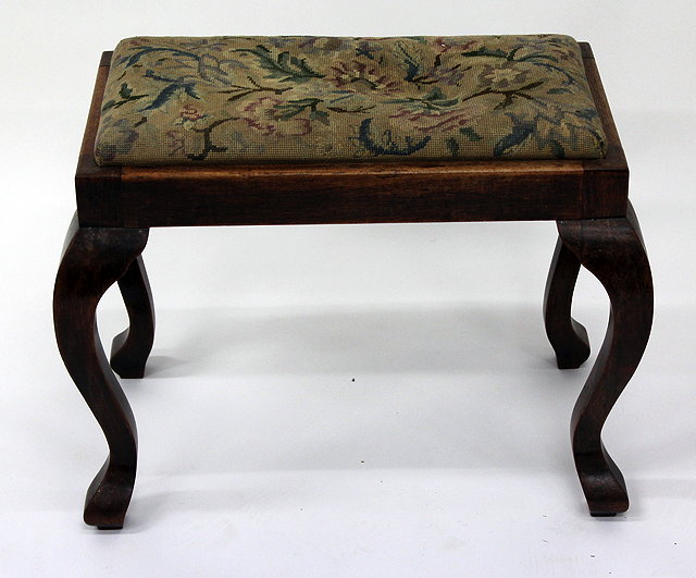 Appraisal: A HARDWOOD RECTANGULAR STOOL with needlework inset seat cabriole legs