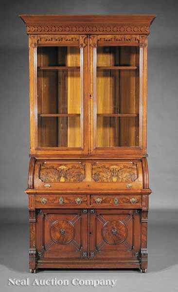 Appraisal: An American Carved and Burl Walnut Cylinder Desk and Bookcase