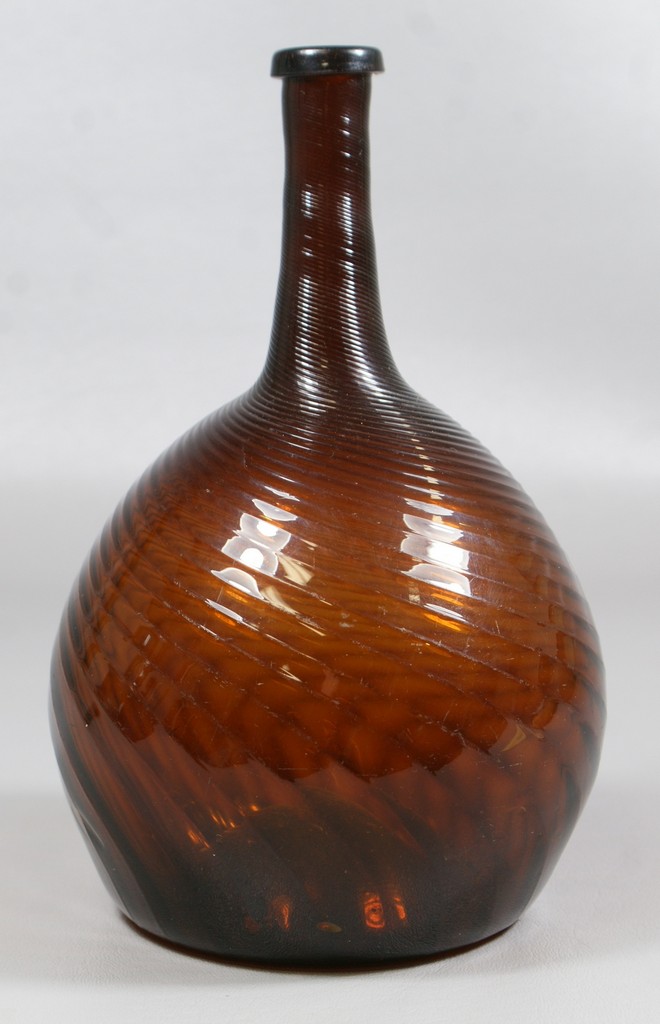 Appraisal: rib Zanesville amber globular bottle swirled left rim chip some