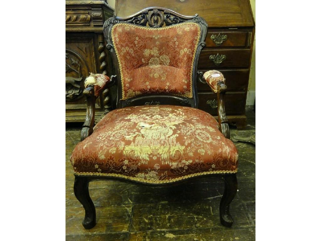 Appraisal: A pair of Victorian open armchairs with serpentine floral upholstered