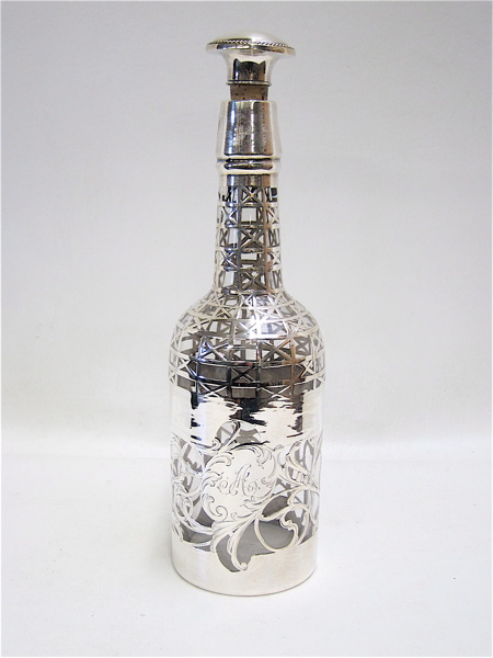 Appraisal: SILVER OVERLAY GLASS DECANTER having intricate silver pattern on clear