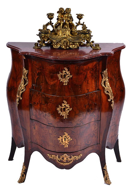 Appraisal: A CONTINENTAL WALNUT KINGWOOD AND MARQUETRY BANDED BOMB COMMODE with