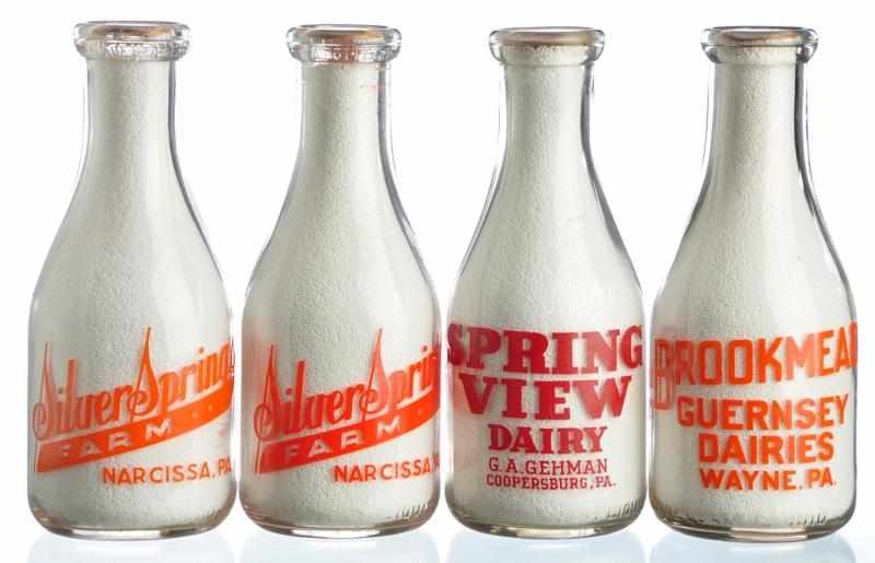 Appraisal: Lot of Pennsylvania Milk Bottles Description Lot includes two bottles