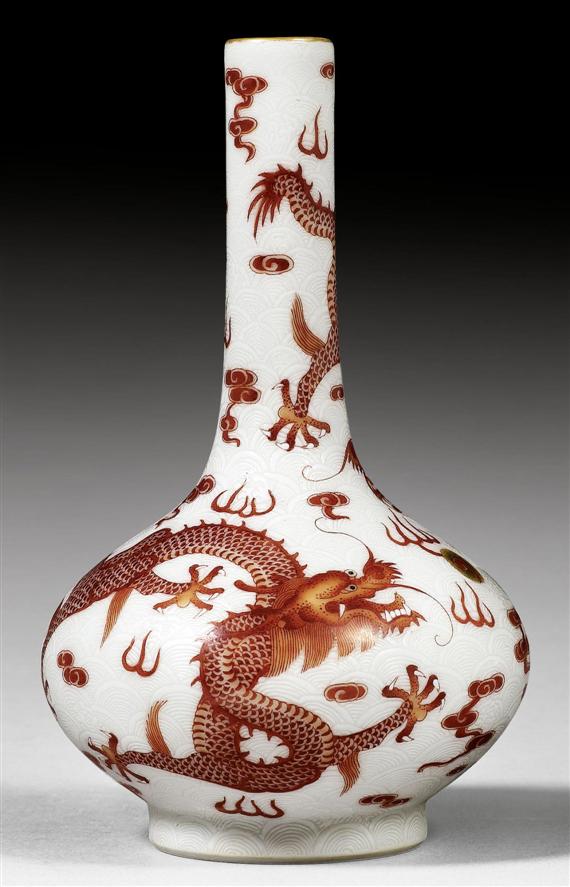 Appraisal: AN EXCELLENT SMALL VASE WITH IRON RED DRAGONS ON INCISED