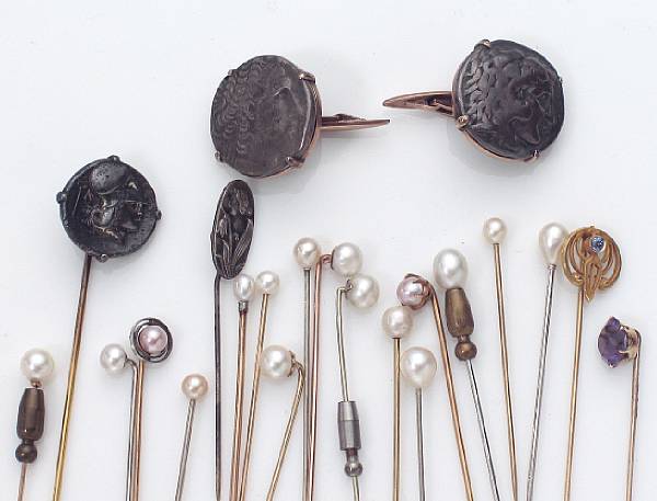 Appraisal: A collection of k and silver stick pins and one