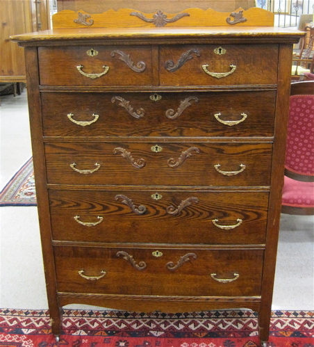 Appraisal: TALL OAK CHEST OF DRAWERS American c having two small