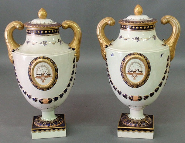 Appraisal: Pair of Mottahedeh porcelain urns with American eagles and swag