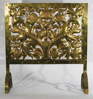 Appraisal: An Arts and Crafts pierced brass firescreen stamped in low