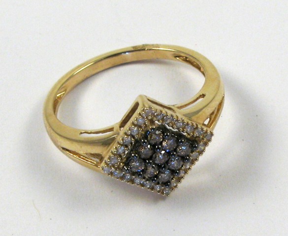 Appraisal: DIAMOND AND FOURTEEN KARAT GOLD RING the top half of