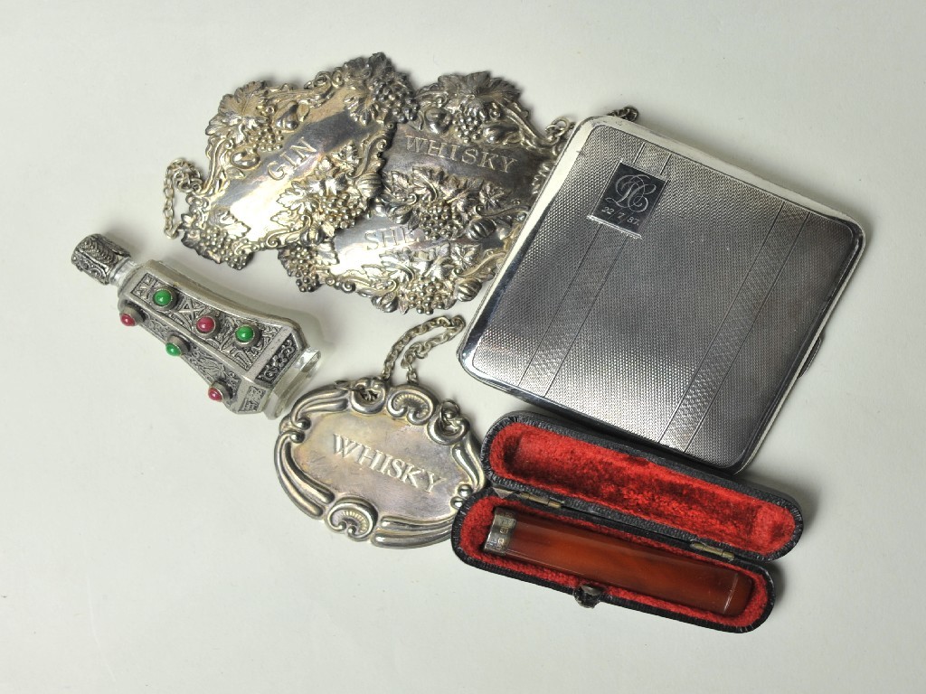 Appraisal: Lot comprising silver cigarette case cigarette holder scent bottle and