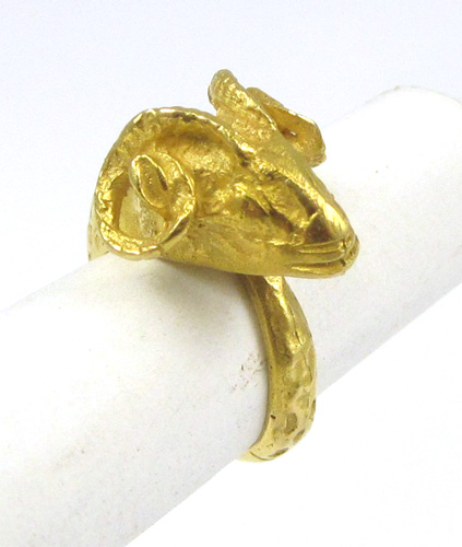 Appraisal: EIGHTEEN KARAT YELLOW GOLD RING weighing grams and depicting a