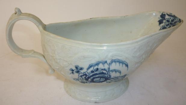 Appraisal: A CHRISTIAN'S LIVERPOOL PORCELAIN SAUCEBOAT with double C scroll handle