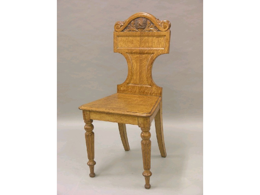 Appraisal: A Victorian oak hall chair by T Seddon scroll cresting