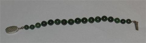 Appraisal: NEPHRITE BEAD BRACELET Comprised of intense green jade beads with