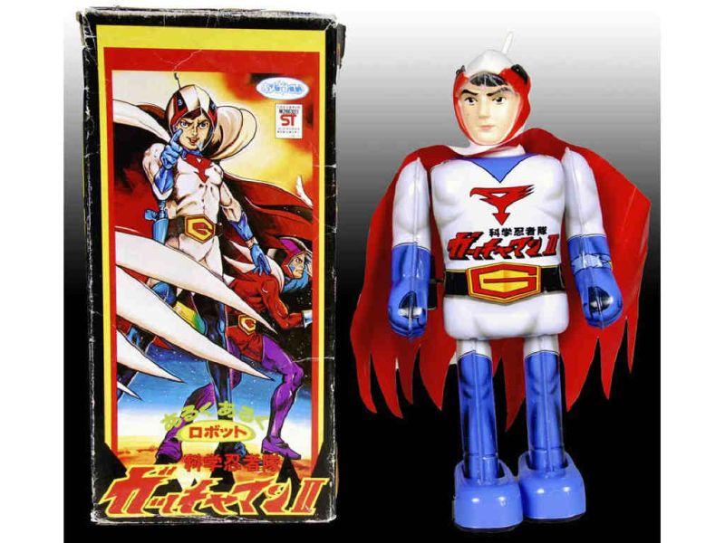 Appraisal: Japanese Tin Wind-Up Gatchaman Ken Superhero Toy w Description ''