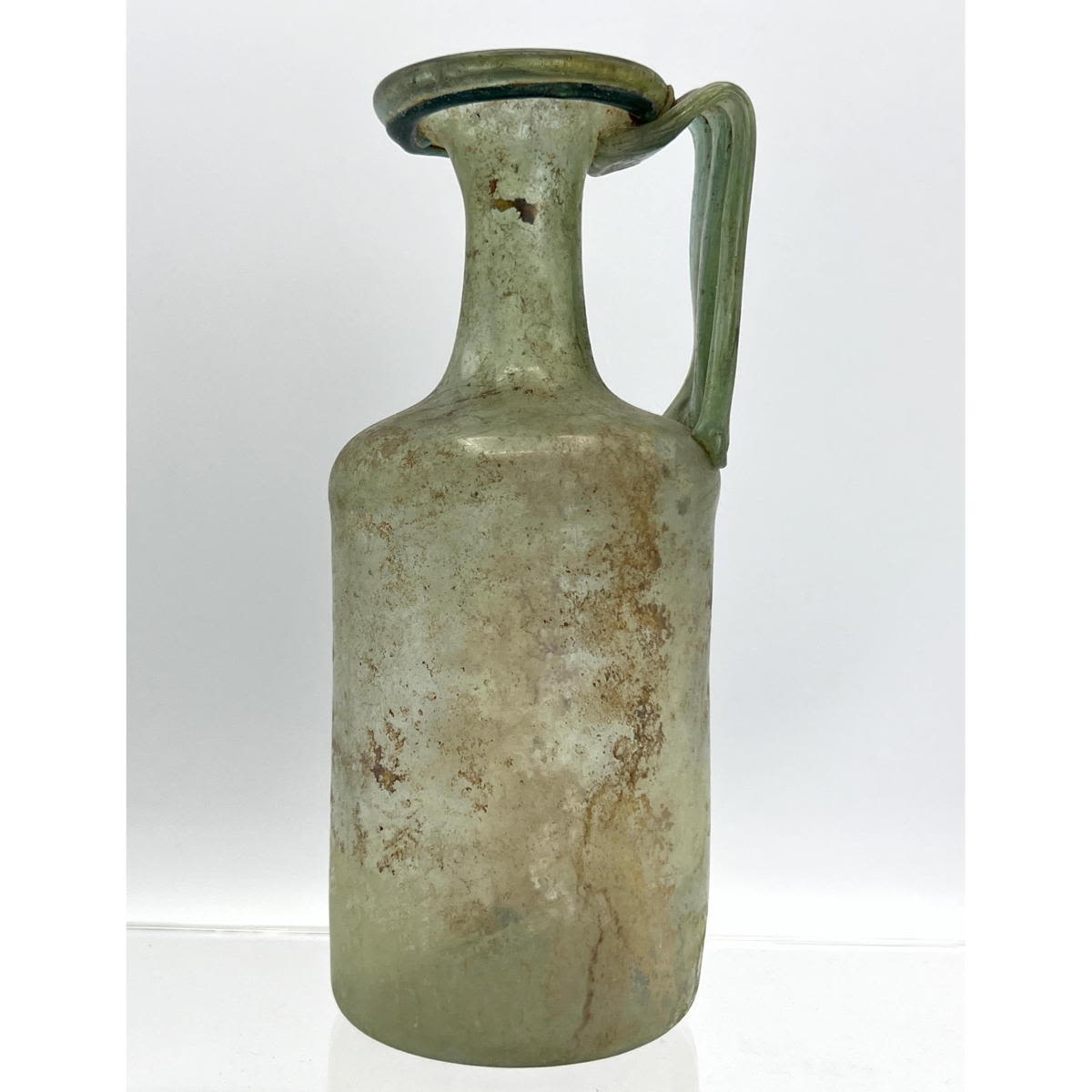 Appraisal: Silvery green handled jug Ancient Roman glass Dimensions H inches