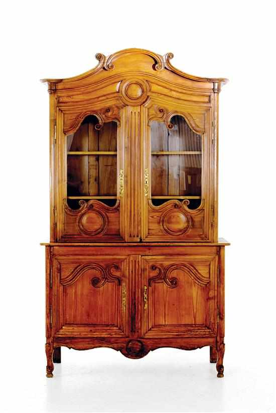 Appraisal: French Provincial pine vaisselier late th century arched and scrolled