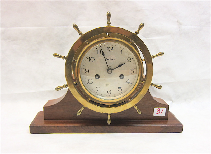 Appraisal: BRASS SHIP'S CLOCK ON WALNUT STAND Waterbury Clock Co Ship's