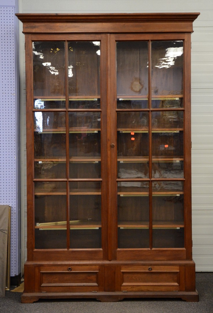 Appraisal: Walnut Victorian bookcase with glass doors and drawers in base