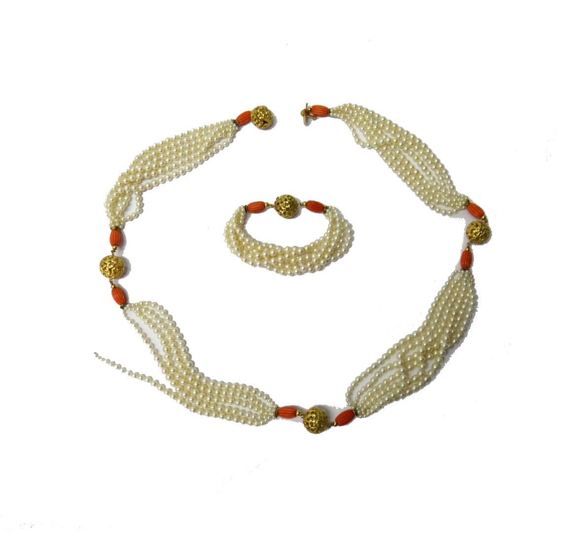 Appraisal: A French gold cultured pearl and carved coral necklace formed