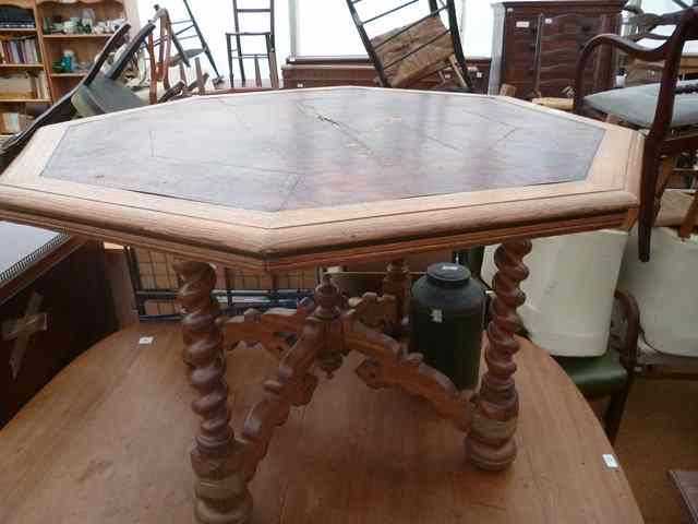 Appraisal: A VICTORIAN OAK OCTAGONAL LIBRARY TABLE with leather inset top