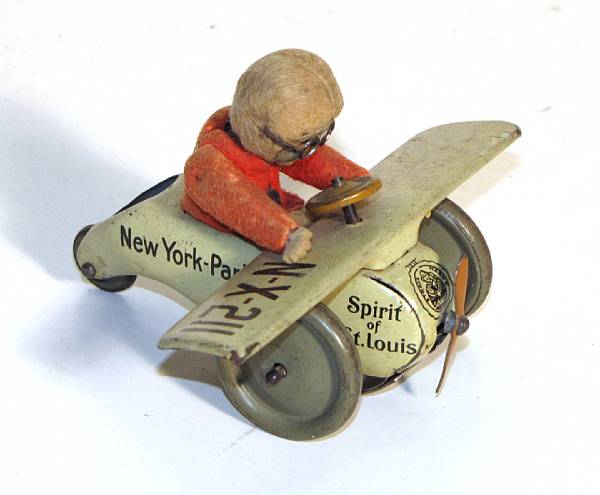 Appraisal: Schuco clockwork airplane Scarce German tin lithographed plane with comical