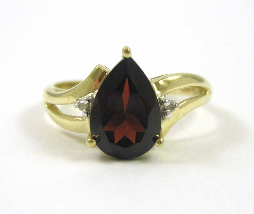 Appraisal: GARNET DIAMOND AND TEN KARAT GOLD RING set with two