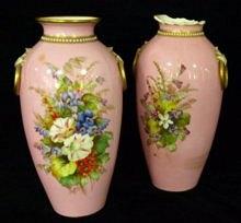 Appraisal: A pair of Royal Worcester vases the pink ground painted