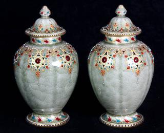 Appraisal: Pair of KPM jeweled porcelain lidded urns Pair of KPM