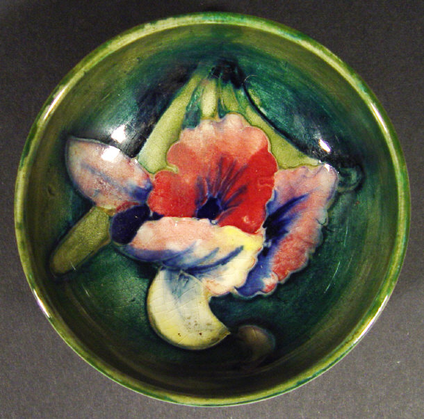 Appraisal: Small Moorcroft dish hand painted and tubelined with orchids onto