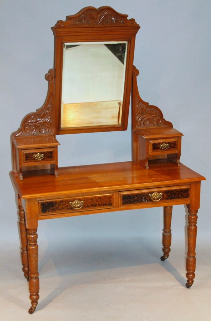 Appraisal: An Edwardian walnut dressing table the rectangular mirror back surmounted