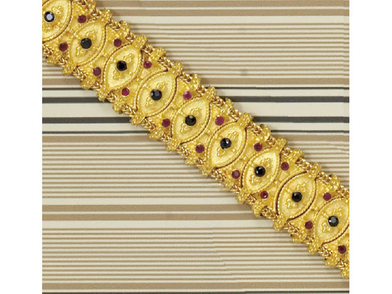 Appraisal: SAPPHIRE AND RUBY BRACELET k yellow gold with raised gold