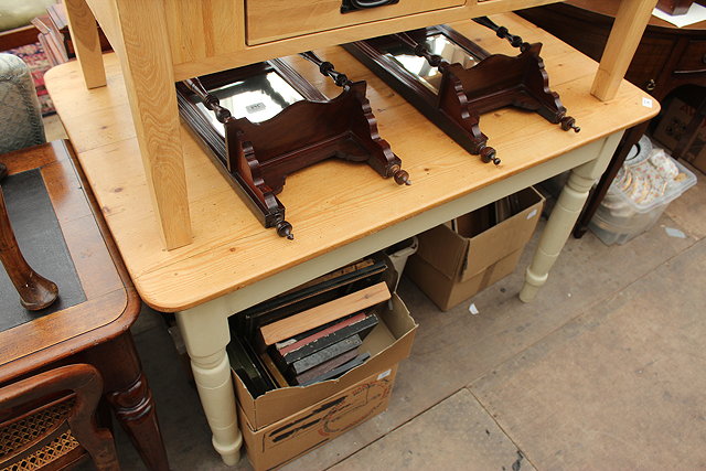 Appraisal: A WAXED PINE FARMHOUSE KITCHEN TABLE the cream painted base