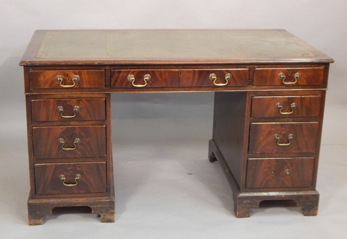 Appraisal: A mahogany pedestal desk in George III style the top