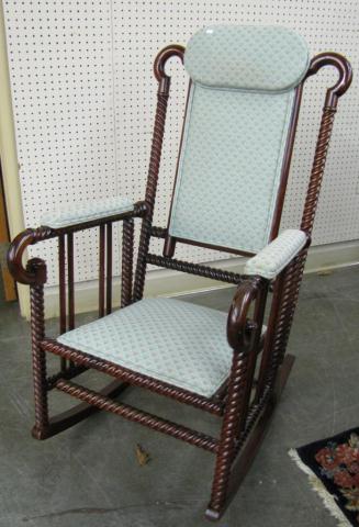 Appraisal: Antique rocking chair with spool-motif mahogany frame upholstered seat back