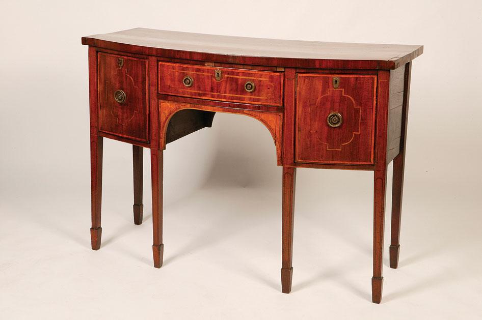 Appraisal: A GEORGE III MAHOGANY BOW FRONT SIDEBOARD the rectangular top