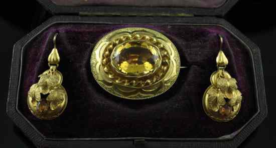 Appraisal: A Victorian citrine set gold brooch and pair of similar