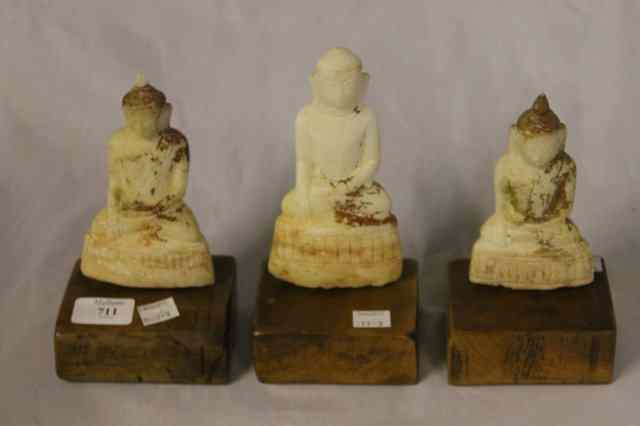 Appraisal: A COLLECTION OF THREE INDIAN MARBLE SEATED DEITIES each on