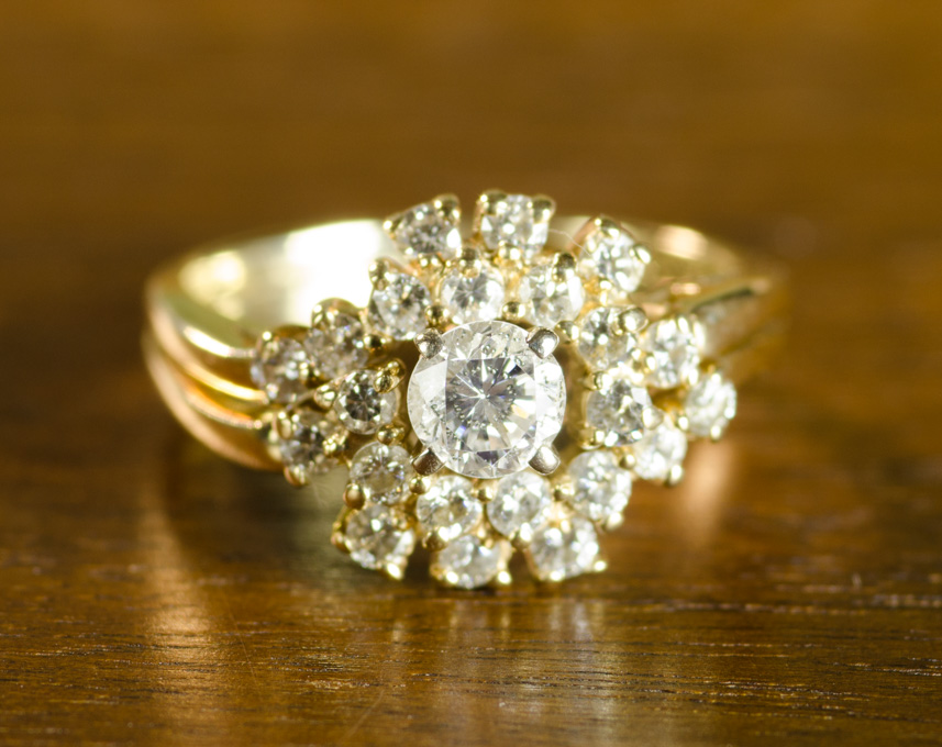 Appraisal: DIAMOND AND FOURTEEN KARAT GOLD RING with round-cut diamonds set