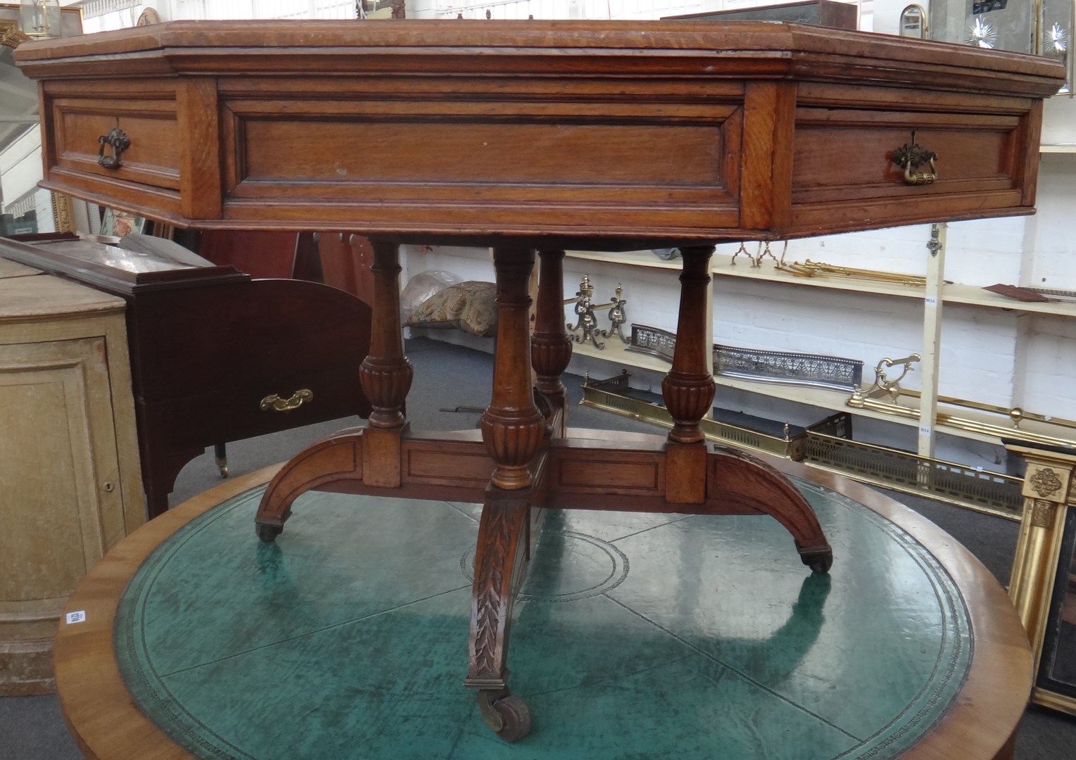 Appraisal: A Victorian oak octagonal drum centre table the rotating top