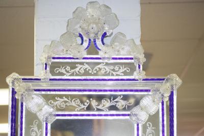 Appraisal: A Venetian style glass wall mirror with blue glass borders