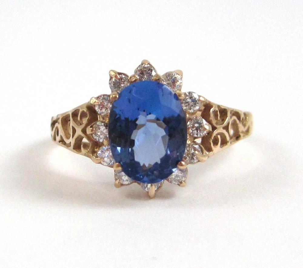 Appraisal: TANZANITE DIAMOND AND FOURTEEN KARAT GOLD RING with twelve round-cut