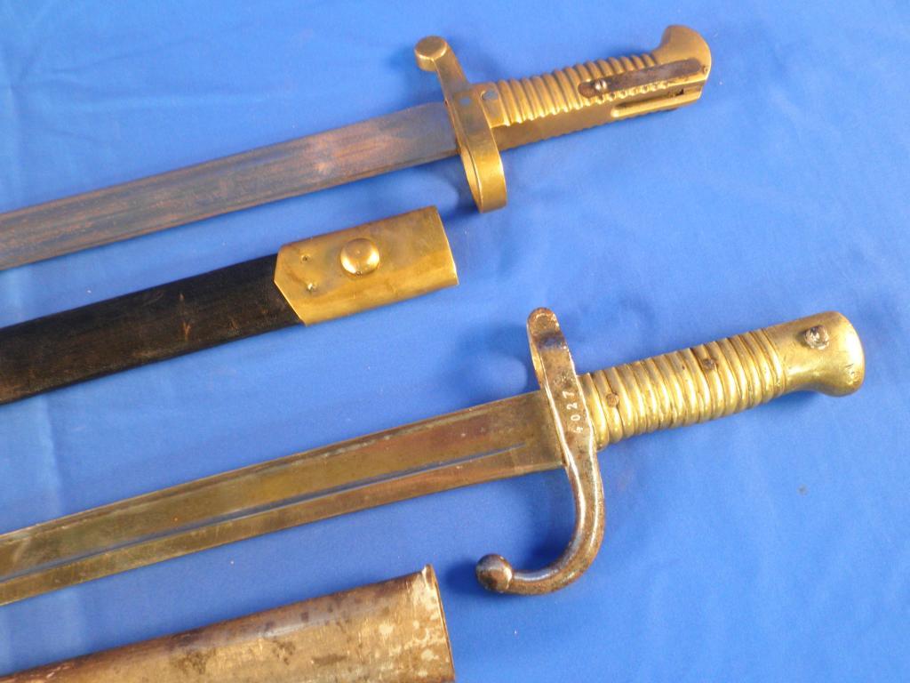 Appraisal: A French bayonet with a steel scabbard and hilt and